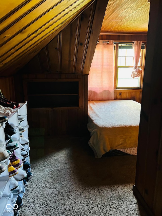 4850 E University Ave, Indianapolis, IN 46201 - unfurnished bedroom featuring carpet, wooden ceiling, wooden walls, and lofted ceiling