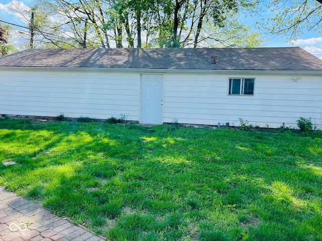 4850 E University Ave, Indianapolis, IN 46201 - view of side of home with a yard and a shingled roof