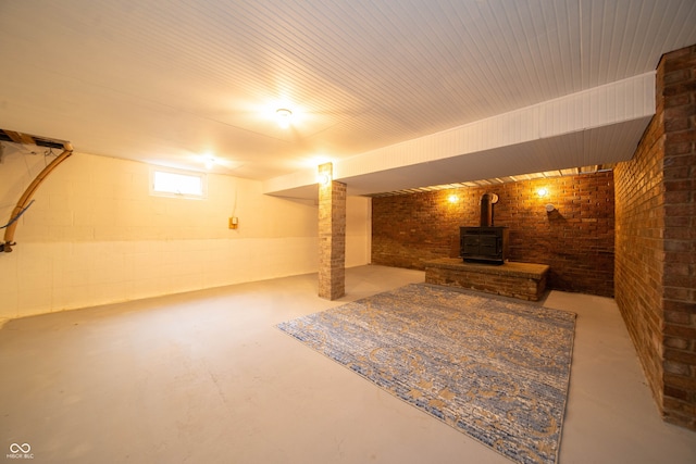 5388 W Hazelrigg Rd, Thorntown, IN 46071 - below grade area with a wood stove and brick wall