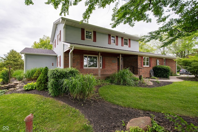 5388 W Hazelrigg Rd, Thorntown, IN 46071 - traditional-style house featuring brick siding and a front yard