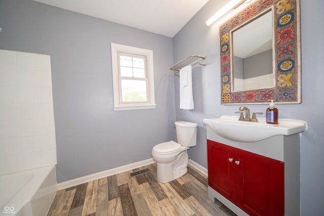 5388 W Hazelrigg Rd, Thorntown, IN 46071 - full bath with wood finished floors, baseboards, toilet, and vanity