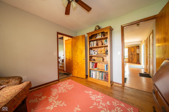 5388 W Hazelrigg Rd, Thorntown, IN 46071 - sitting room featuring wood finished floors, ceiling fan, and baseboards