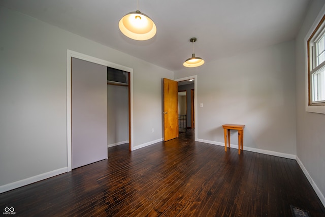 5388 W Hazelrigg Rd, Thorntown, IN 46071 - unfurnished bedroom with wood-type flooring, baseboards, and a closet