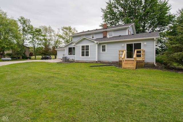 5388 W Hazelrigg Rd, Thorntown, IN 46071 - rear view of house featuring cooling unit, a yard, a chimney, and driveway