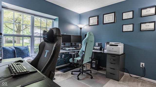 carpeted office space with baseboards