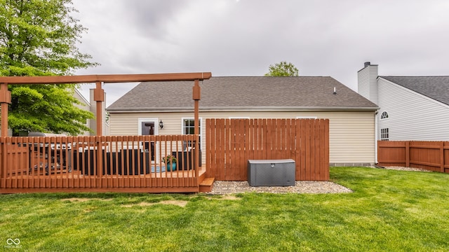 rear view of property with a wooden deck, roof with shingles, and central air condition unit