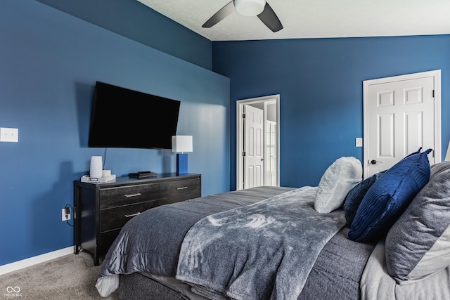 bedroom with carpet floors, baseboards, vaulted ceiling, and a ceiling fan