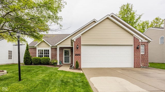 ranch-style home with brick siding, a garage, concrete driveway, and a front lawn