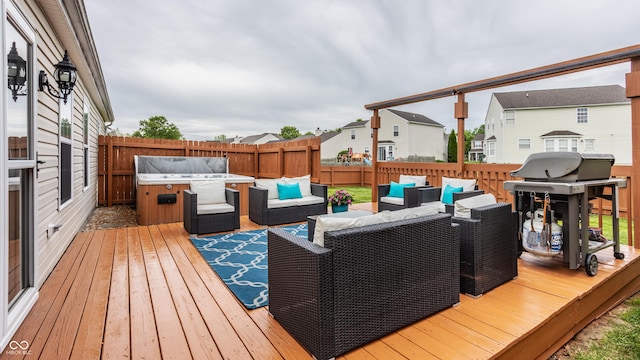 wooden deck with outdoor lounge area, a fenced backyard, and a grill
