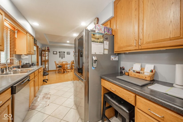 188 Bay Ridge Dr, Pendleton, IN 46064 - kitchen featuring appliances with stainless steel finishes, a sink, recessed lighting, dark countertops, and light tile patterned flooring