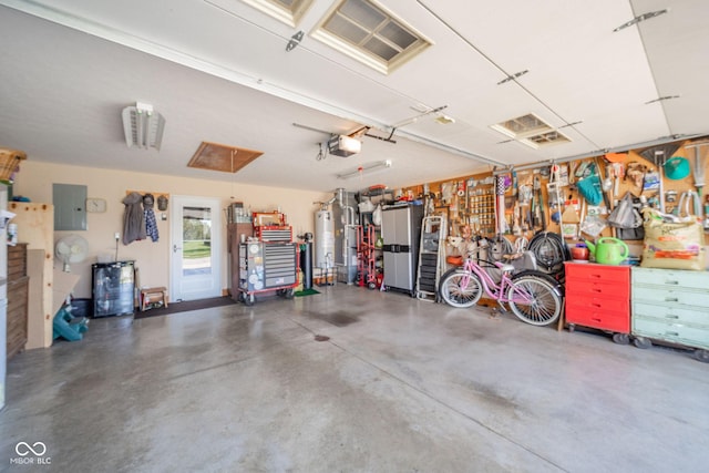 188 Bay Ridge Dr, Pendleton, IN 46064 - garage featuring a garage door opener, electric panel, and gas water heater