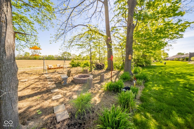 188 Bay Ridge Dr, Pendleton, IN 46064 - view of grassy yard with a fire pit