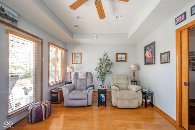 188 Bay Ridge Dr, Pendleton, IN 46064 - living area with light wood finished floors, a tray ceiling, ceiling fan, recessed lighting, and baseboards