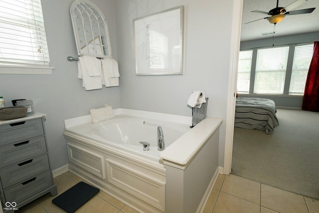 11727 Wedgeport Ln, Fishers, IN 46037 - full bathroom featuring a garden tub, plenty of natural light, and tile patterned floors