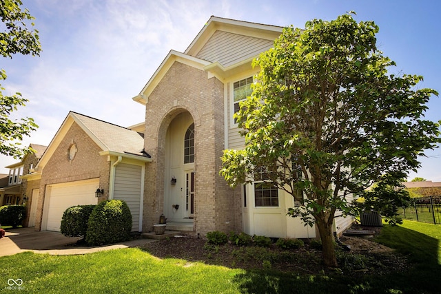 11727 Wedgeport Ln, Fishers, IN 46037 - traditional home featuring brick siding, a garage, and concrete driveway
