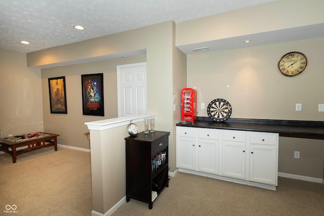 11727 Wedgeport Ln, Fishers, IN 46037 - hallway with light carpet, baseboards, recessed lighting, and a textured ceiling