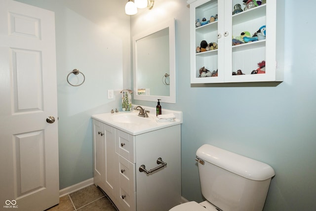 11727 Wedgeport Ln, Fishers, IN 46037 - half bathroom featuring vanity, toilet, baseboards, and tile patterned flooring
