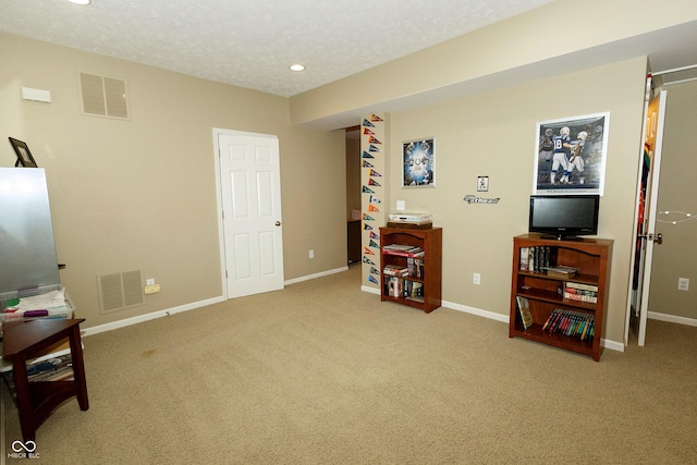 11727 Wedgeport Ln, Fishers, IN 46037 - sitting room with carpet, baseboards, recessed lighting, and a textured ceiling
