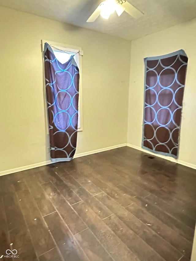 834 N Temple Ave, Indianapolis, IN 46201 - unfurnished room featuring hardwood / wood-style floors, a ceiling fan, and baseboards