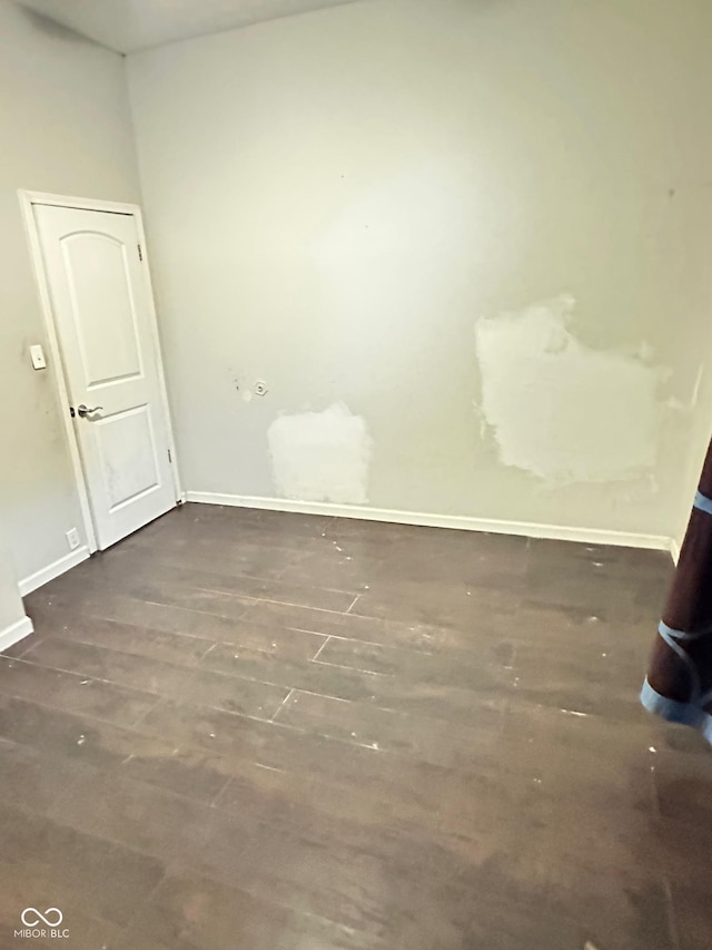 834 N Temple Ave, Indianapolis, IN 46201 - spare room featuring wood finished floors and baseboards