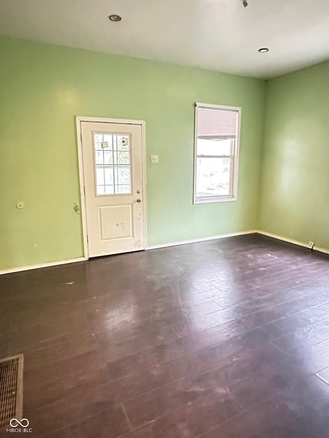 834 N Temple Ave, Indianapolis, IN 46201 - unfurnished living room with plenty of natural light and baseboards