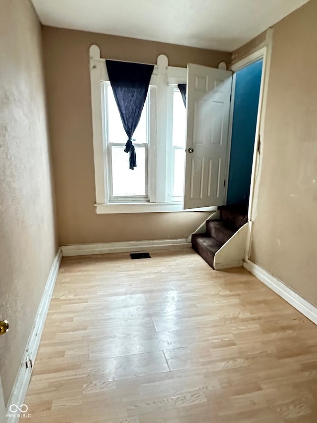 834 N Temple Ave, Indianapolis, IN 46201 - empty room with wood finished floors and baseboards