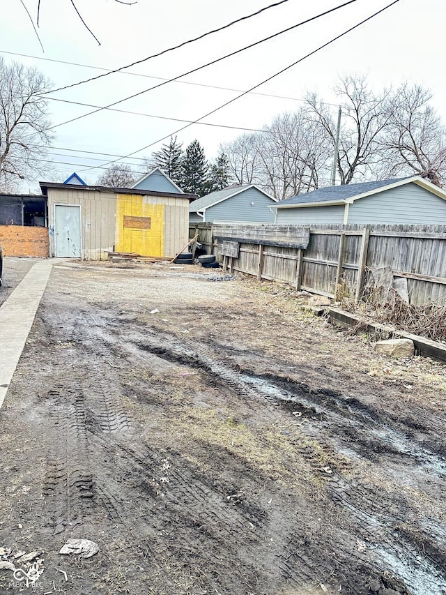 834 N Temple Ave, Indianapolis, IN 46201 - view of yard featuring fence, a storage shed, and an outbuilding