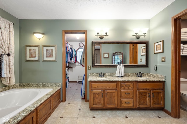 6575 Robin Hood Dr, Indianapolis, IN 46227 - bathroom with toilet, double vanity, a bath, tile patterned floors, and baseboards
