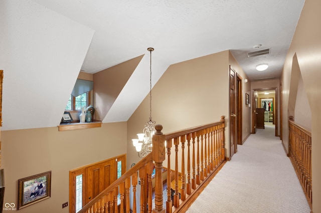 6575 Robin Hood Dr, Indianapolis, IN 46227 - hall featuring light colored carpet, a chandelier, and an upstairs landing
