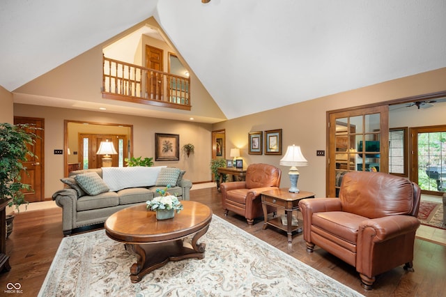 6575 Robin Hood Dr, Indianapolis, IN 46227 - living room featuring high vaulted ceiling, a ceiling fan, wood finished floors, and baseboards