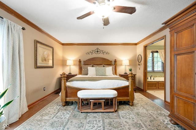 6575 Robin Hood Dr, Indianapolis, IN 46227 - bedroom featuring crown molding, baseboards, light wood-type flooring, and a ceiling fan