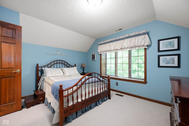 6575 Robin Hood Dr, Indianapolis, IN 46227 - bedroom with lofted ceiling, carpet flooring, baseboards, and a textured ceiling