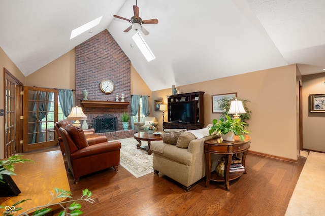 6575 Robin Hood Dr, Indianapolis, IN 46227 - living room with a skylight, ceiling fan, wood finished floors, high vaulted ceiling, and a fireplace