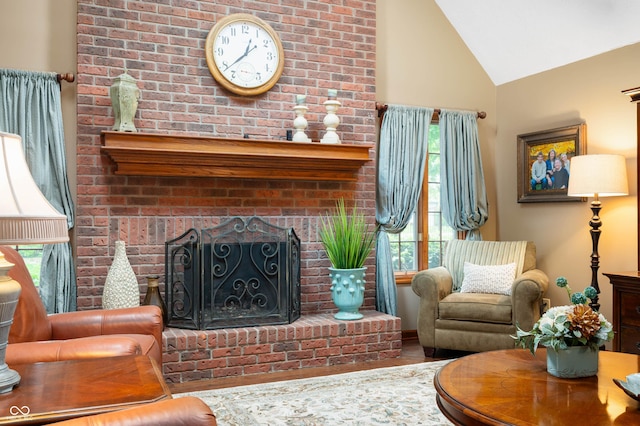 6575 Robin Hood Dr, Indianapolis, IN 46227 - living room featuring plenty of natural light, wood finished floors, high vaulted ceiling, and a brick fireplace