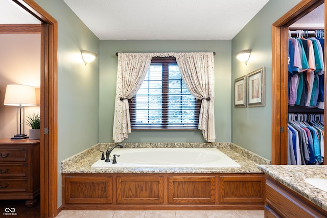 6575 Robin Hood Dr, Indianapolis, IN 46227 - full bath featuring a bath, tile patterned flooring, and a walk in closet