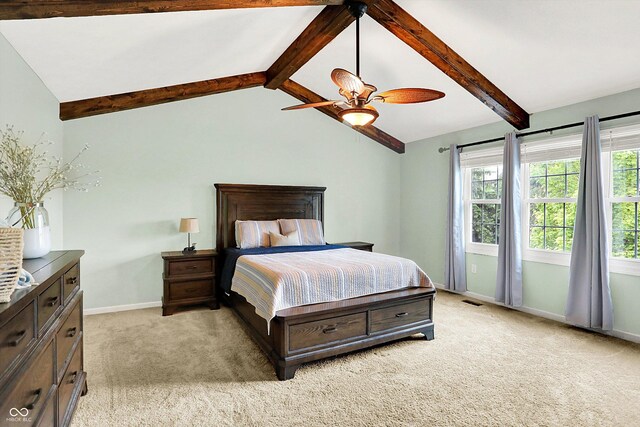 bedroom with light colored carpet, baseboards, and a ceiling fan