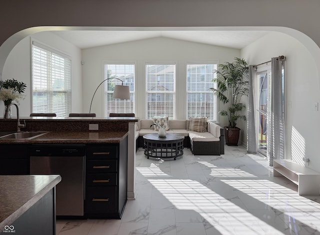 8644 N Deer Crossing Blvd, Mccordsville, IN 46055 - living area with light marble finish floors, arched walkways, and vaulted ceiling