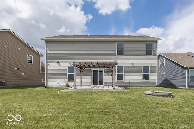rear view of house with a pergola, a patio area, a yard, a fire pit, and central air condition unit