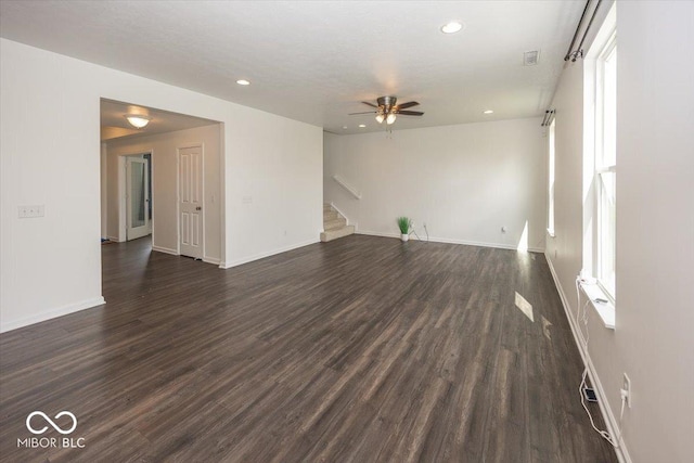 unfurnished living room with ceiling fan, stairs, recessed lighting, dark wood-style flooring, and baseboards