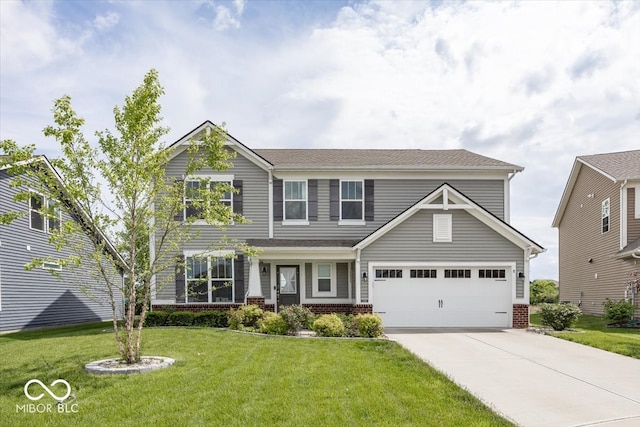 view of front of home with brick siding, driveway, a front lawn, and a garage
