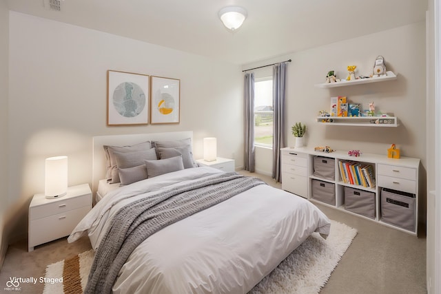 bedroom featuring light carpet