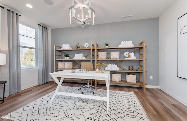 office featuring light wood-type flooring, baseboards, a chandelier, and recessed lighting