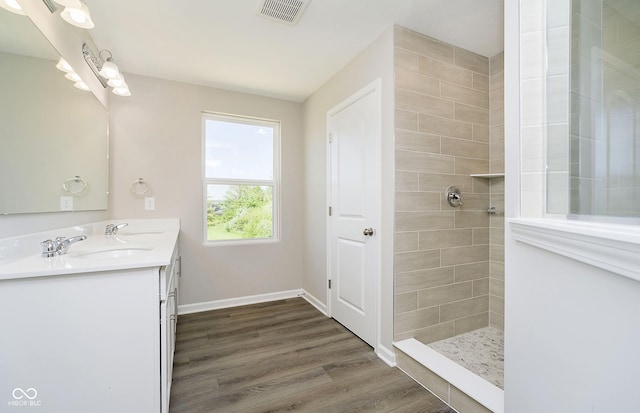 3256 Fawn Cir, Brownsburg, IN 46112 - full bathroom with double vanity, wood finished floors, walk in shower, and baseboards