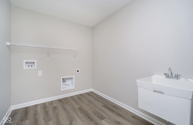 3256 Fawn Cir, Brownsburg, IN 46112 - laundry area featuring hookup for an electric dryer, washer hookup, wood finished floors, and baseboards