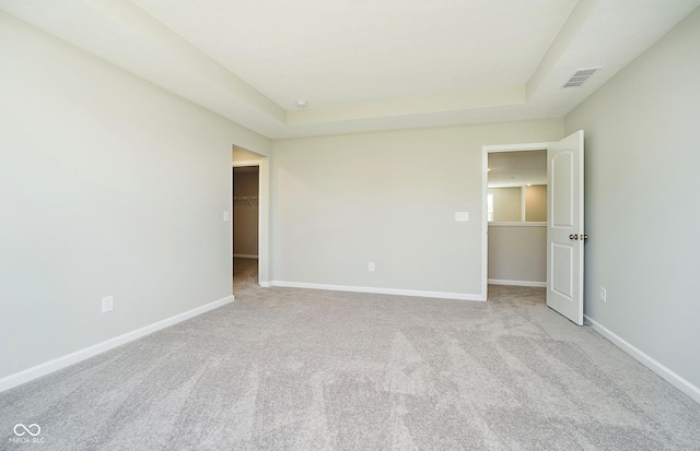 3256 Fawn Cir, Brownsburg, IN 46112 - unfurnished bedroom with a walk in closet, a raised ceiling, and carpet flooring