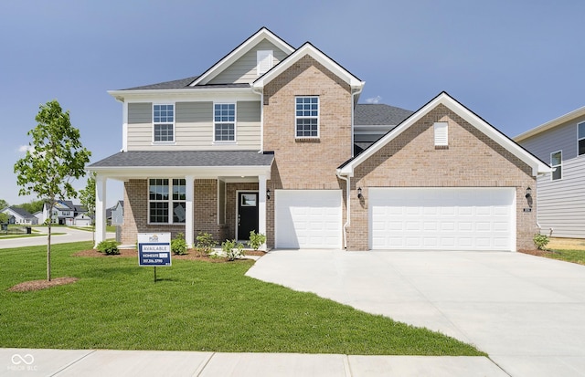 3256 Fawn Cir, Brownsburg, IN 46112 - view of front of home featuring driveway, a front lawn, brick siding, an attached garage, and roof with shingles