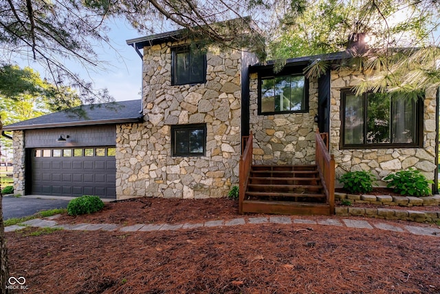 1940 Stringtown Pike, Cicero, IN 46034 - view of front of property with stone siding, driveway, a garage, and a shingled roof