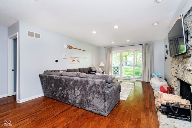 1940 Stringtown Pike, Cicero, IN 46034 - living area with wood finished floors, a stone fireplace, recessed lighting, and baseboards