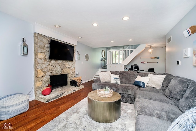 1940 Stringtown Pike, Cicero, IN 46034 - living area with wood finished floors, stairs, an office area, a stone fireplace, and recessed lighting