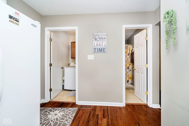 1940 Stringtown Pike, Cicero, IN 46034 - hall featuring washer / dryer, wood finished floors, and baseboards
